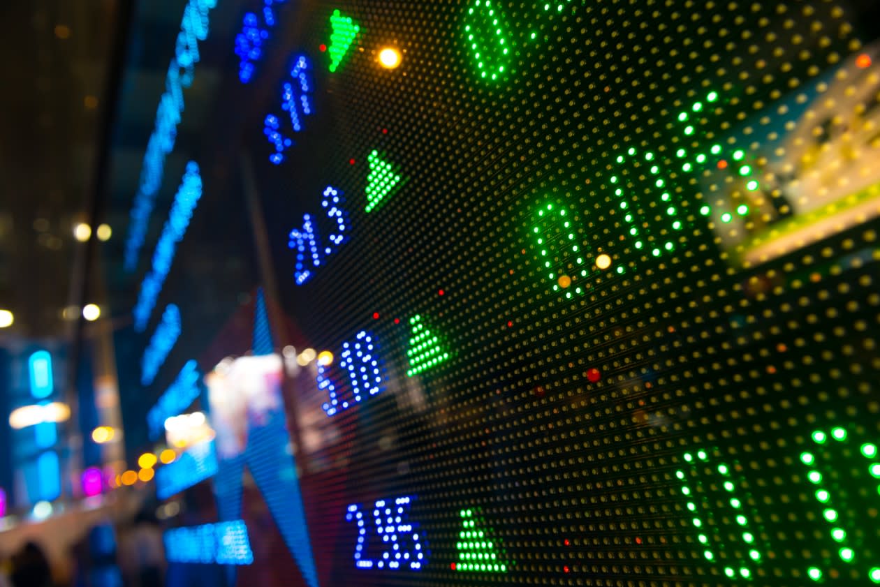 Closeup of green tickers on a stock market index display board.jpg