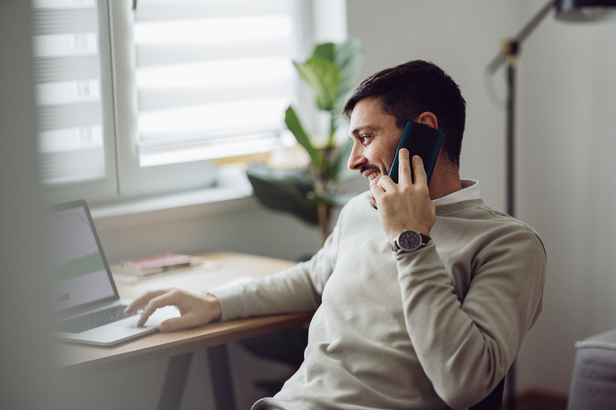 Man Using a Laptop for Online Trading While Working From Home.jpg